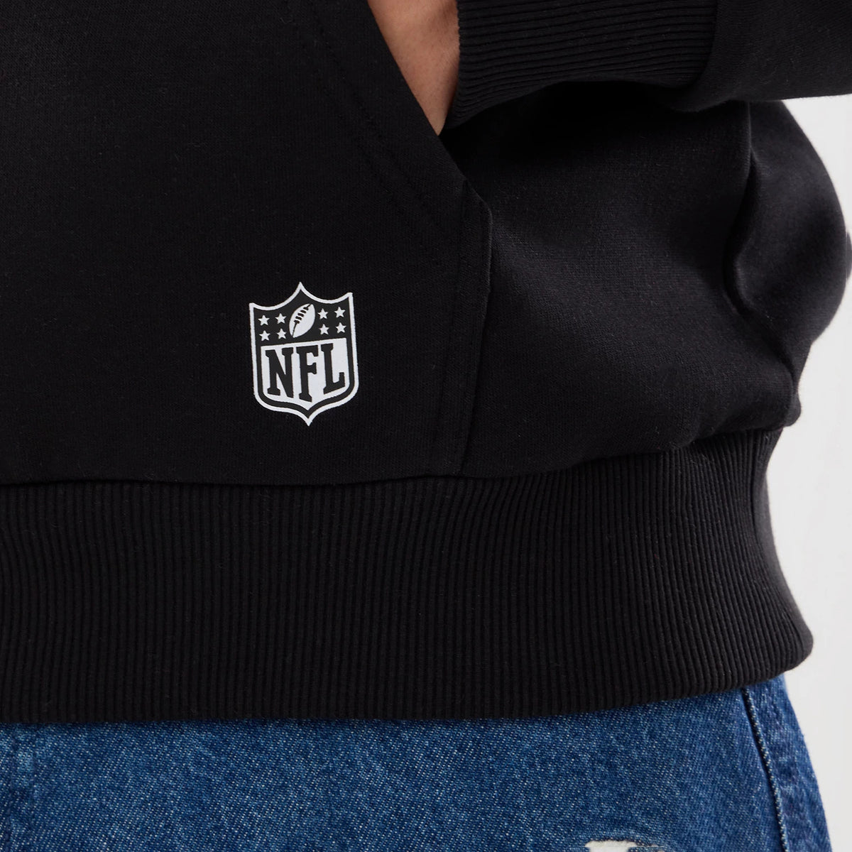 The model is wearing this NFL Patch New Orleans Saints Pullover Hoodie in black. 4