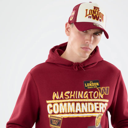 The model is wearing this NFL Patch Washington Commanders Pullover Hoodie in dark red. 5