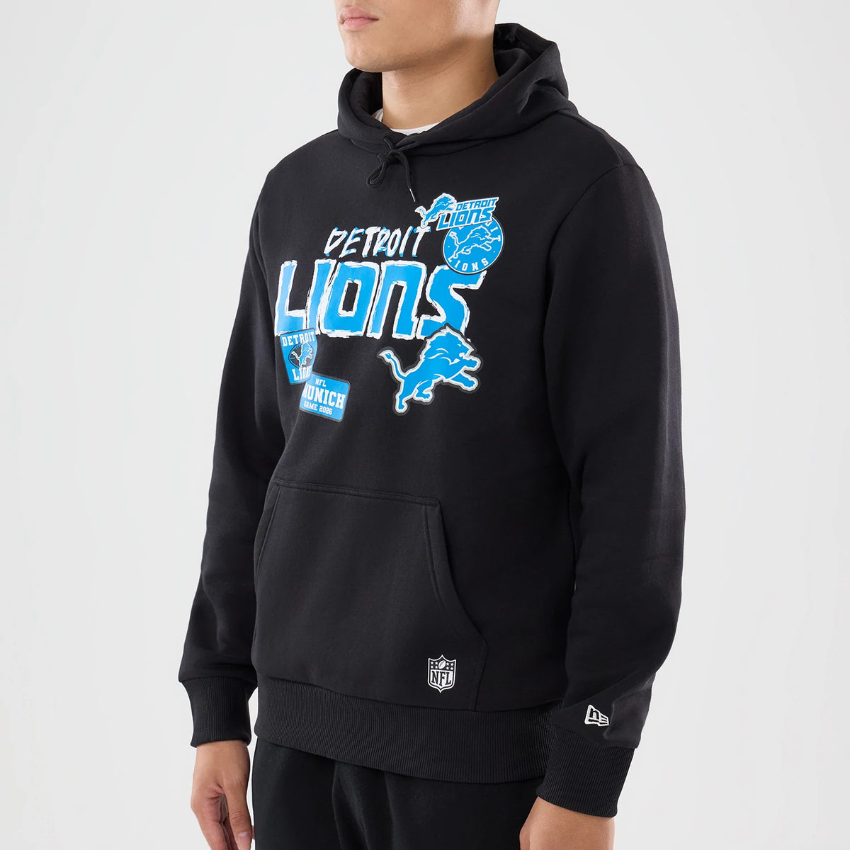 The model is wearing this NFL Patch Detroit Lions Pullover Hoodie in black. 3
