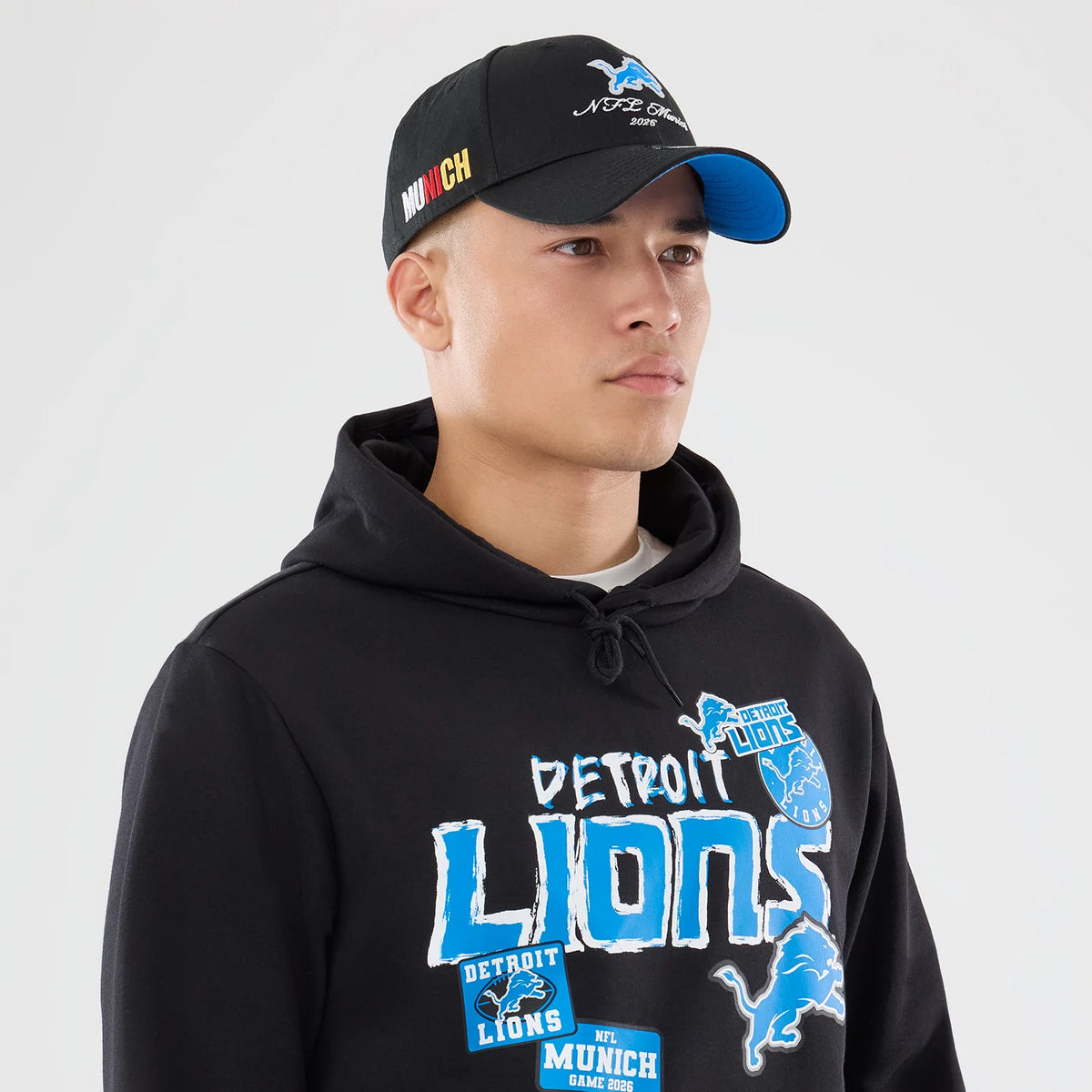 The model is wearing this NFL Patch Detroit Lions Pullover Hoodie in black. 6
