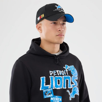 The model is wearing this NFL Patch Detroit Lions Pullover Hoodie in black. 6