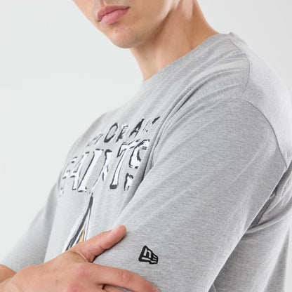 The model is wearing this NFL Graphic Slogan New Orleans Saints Oversized T-Shirt in grey. 5