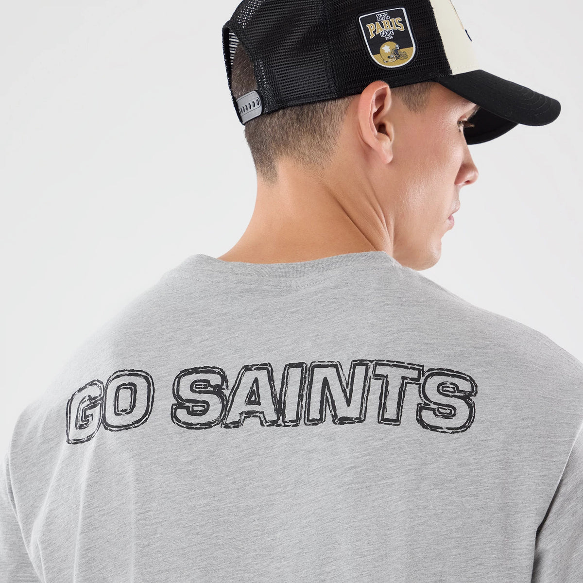 The model is wearing this NFL Graphic Slogan New Orleans Saints Oversized T-Shirt in grey. 7