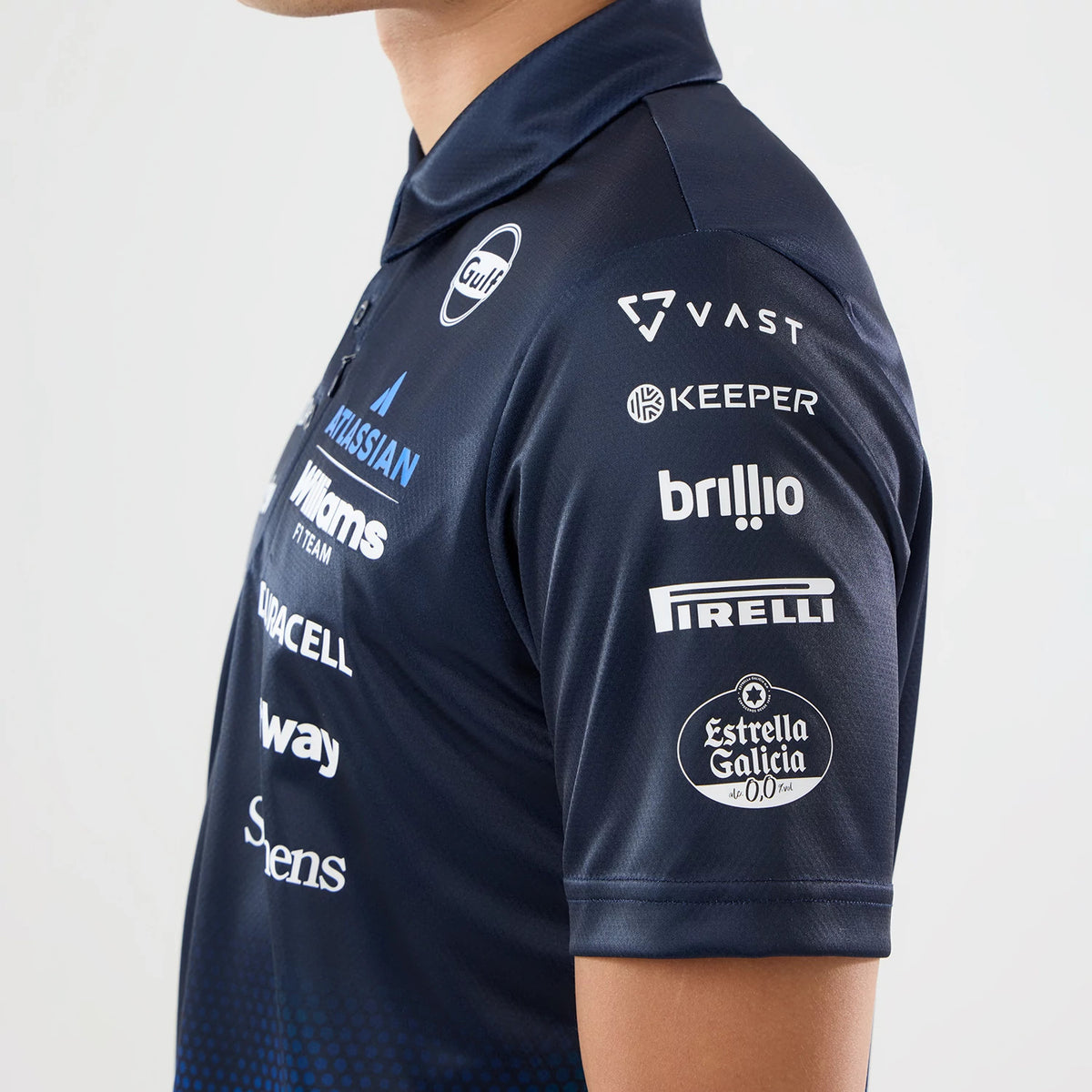 The model is wearing this Singapore Williams Tech Polo T-Shirt in navy. 5