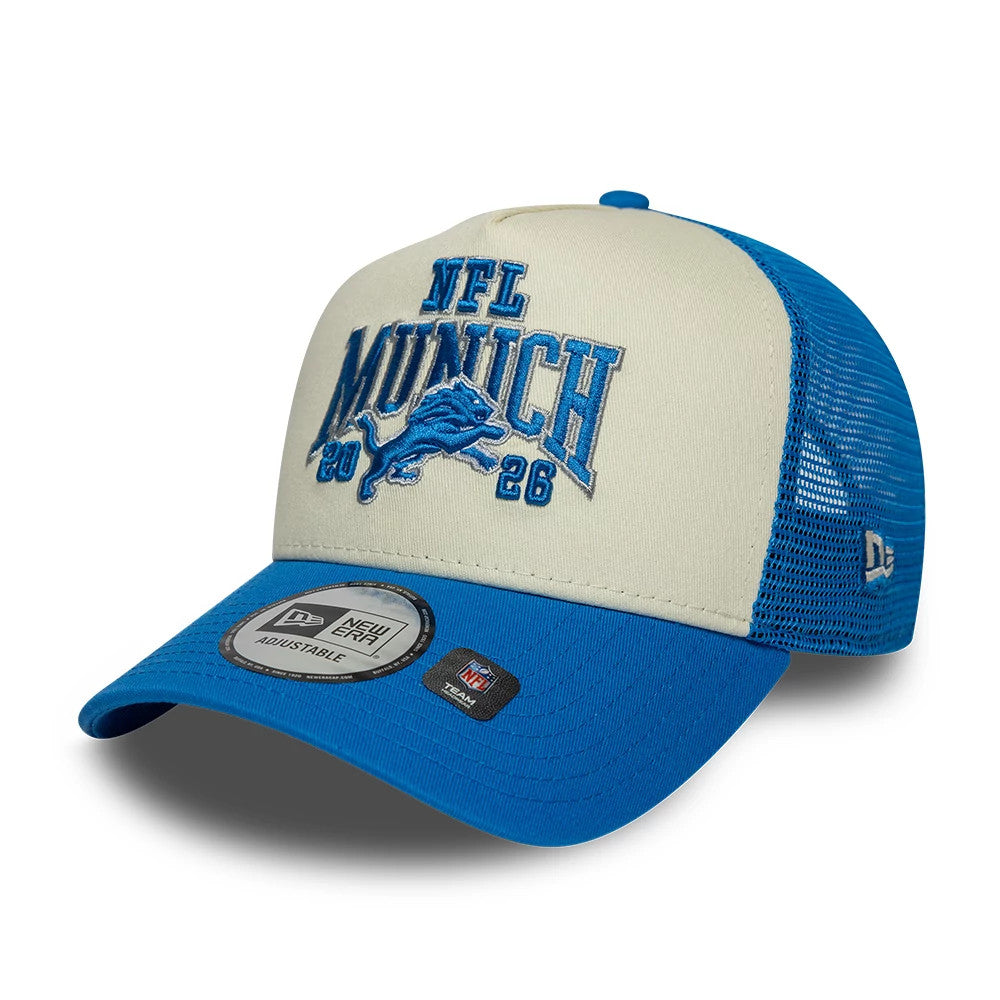 Pictured is this NFL International Games 2026 Munich Detroit Lions 9FORTY A-Frame Trucker cap in blue. 3