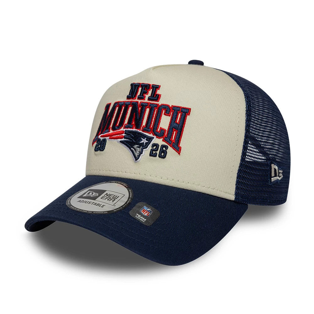 Pictured is this NFL International Games 2026 Munich New England Patriots 9FORTY A-Frame Trucker cap in dark blue. 3