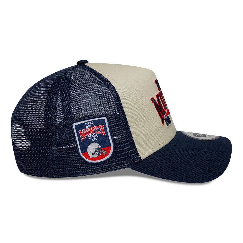 Pictured is this NFL International Games 2026 Munich New England Patriots 9FORTY A-Frame Trucker cap in dark blue. 6