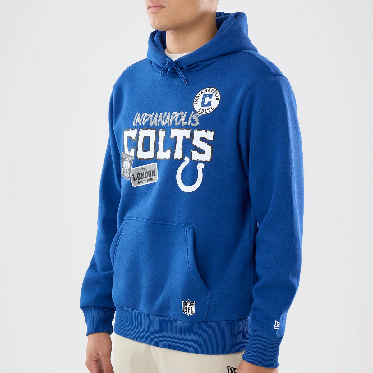 The model is wearing this NFL International Series Games 2026 Indianapolis Colts Pullover Hoodie in blue. 3