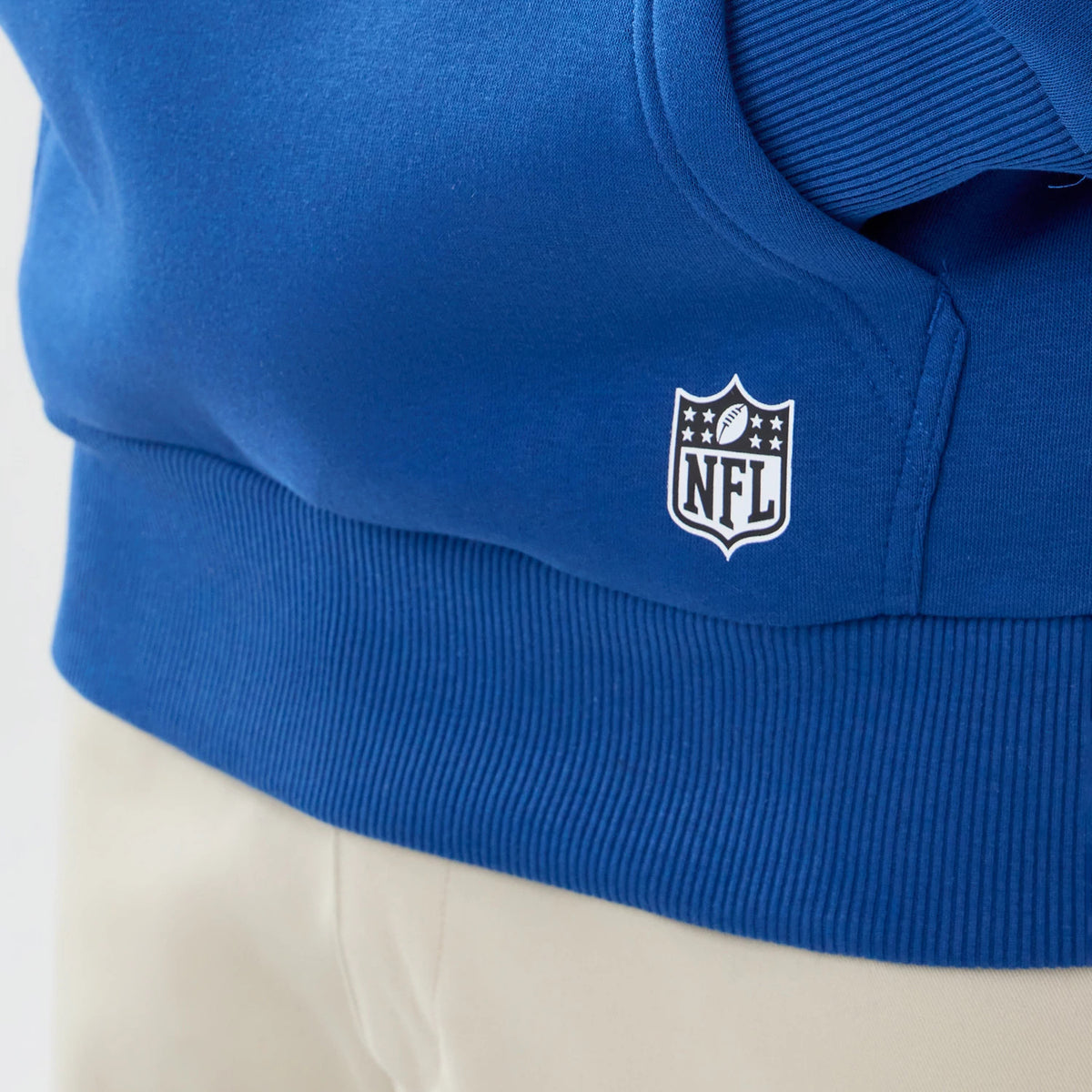 The model is wearing this NFL International Series Games 2026 Indianapolis Colts Pullover Hoodie in blue. 4