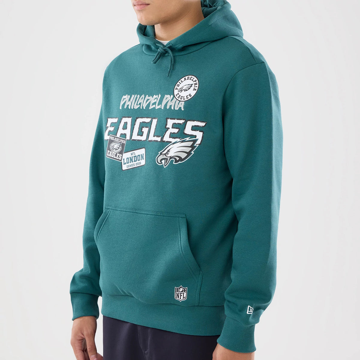 The model is wearing this NFL International Series Games 2026 Philadelphia Eagles Pullover Hoodie in dark green. 3