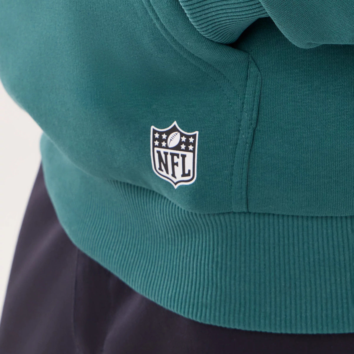 The model is wearing this NFL International Series Games 2026 Philadelphia Eagles Pullover Hoodie in dark green. 4
