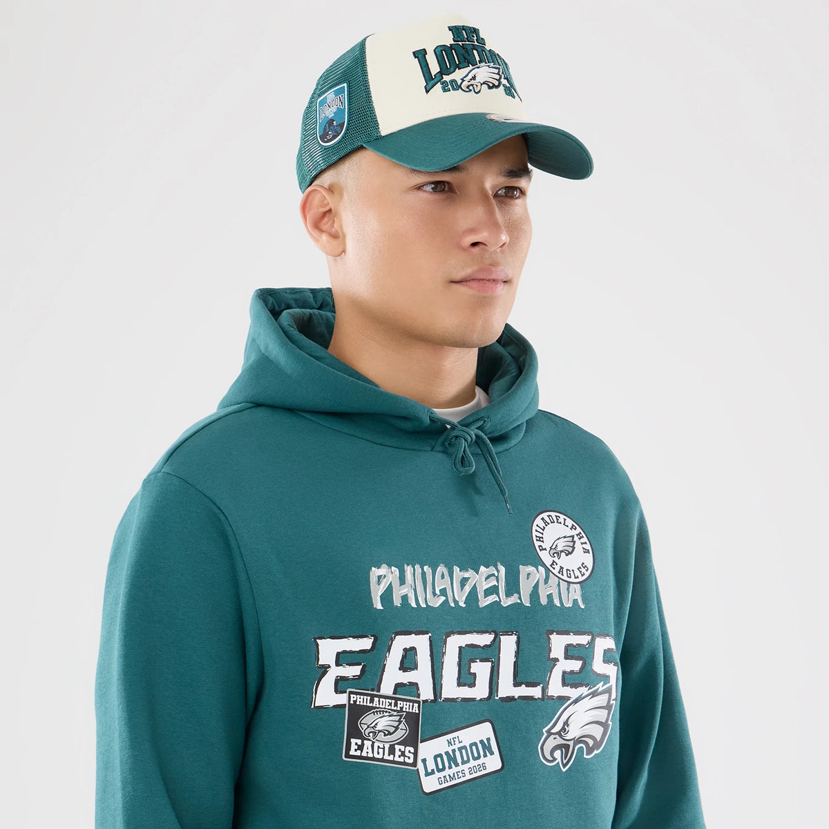 The model is wearing this NFL International Series Games 2026 Philadelphia Eagles Pullover Hoodie in dark green. 6