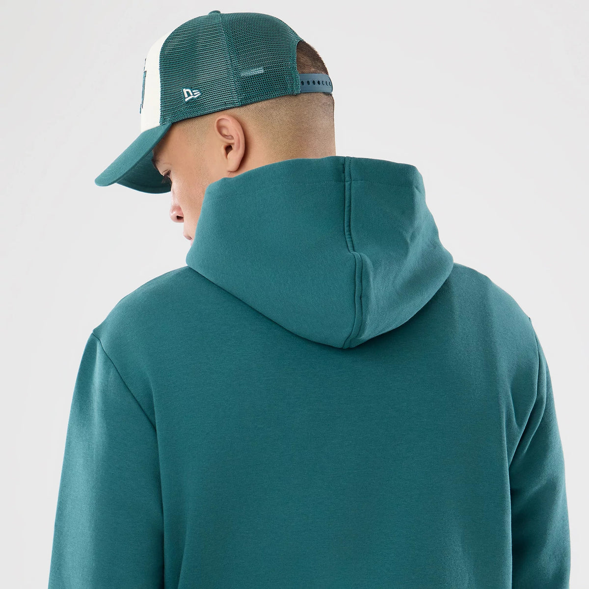 The model is wearing this NFL International Series Games 2026 Philadelphia Eagles Pullover Hoodie in dark green. 7