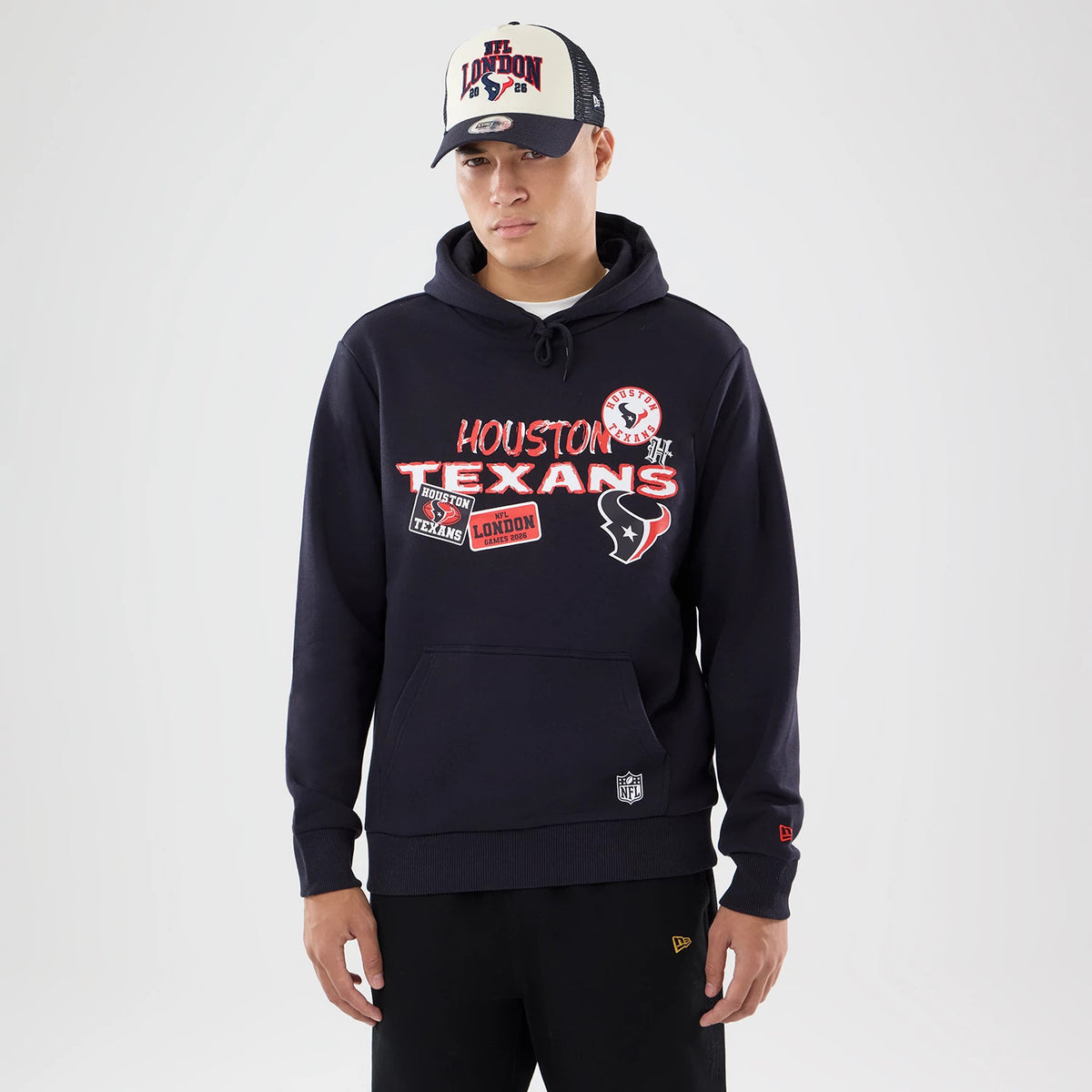 The model is wearing this NFL International Series Games 2026 Houston Texans Pullover Hoodie in navy. 1