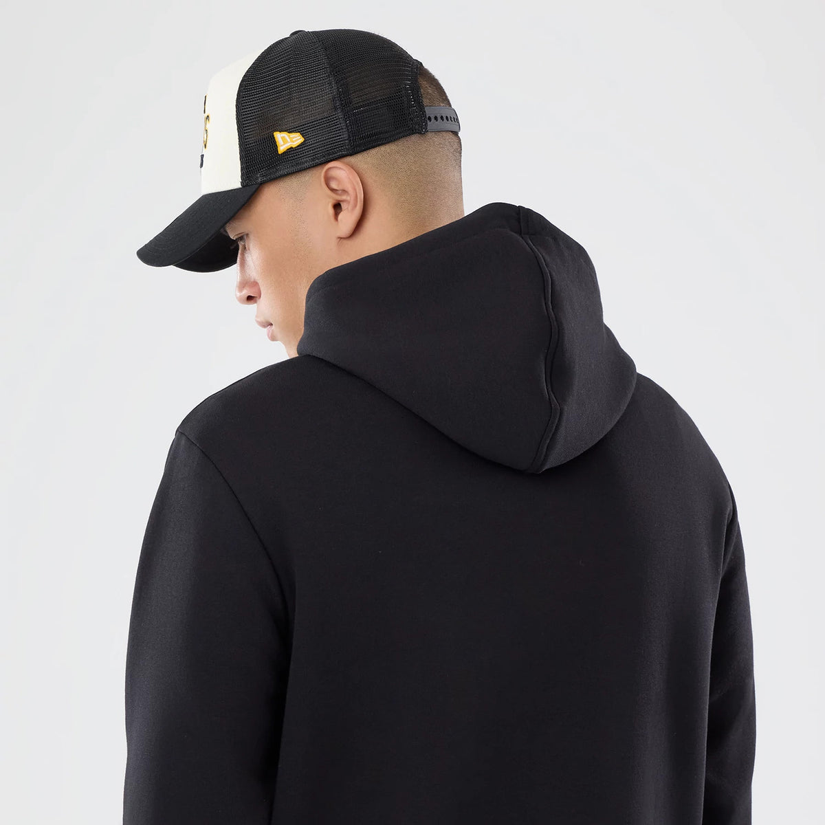 The model is wearing this NFL International Series Games 2026 Pittsburgh Steelers Pullover Hoodie in black. 7