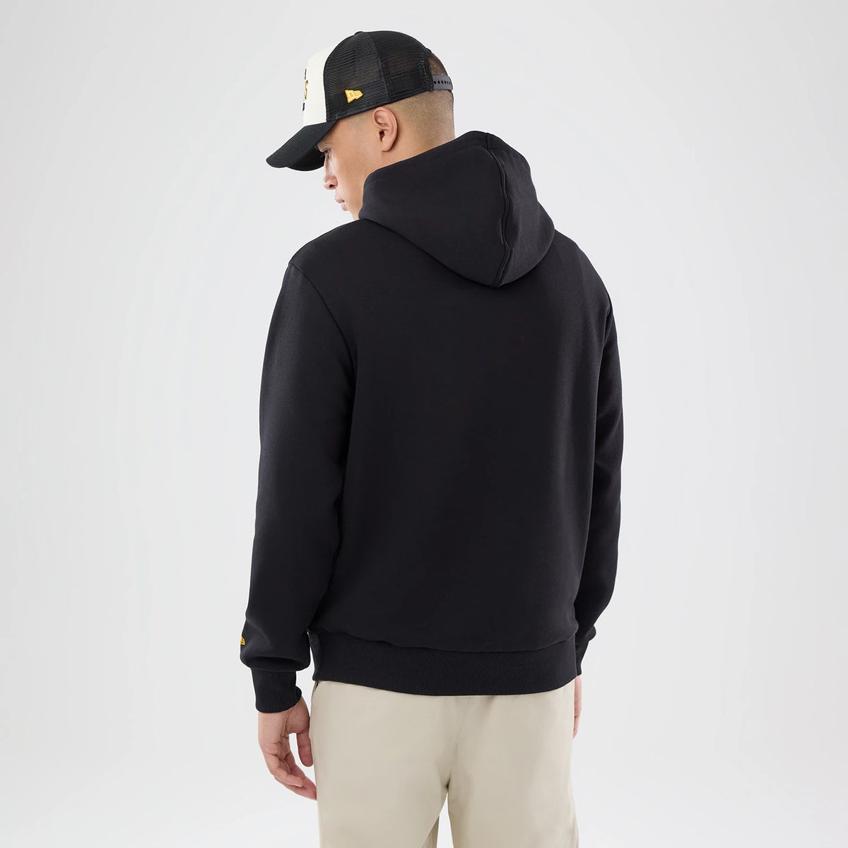The model is wearing this NFL International Series Games 2026 Pittsburgh Steelers Pullover Hoodie in black. 2