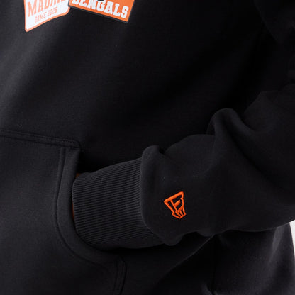 The model is wearing this NFL International Series Games 2026 Cincinnati Bengals Pullover Hoodie in black. 5