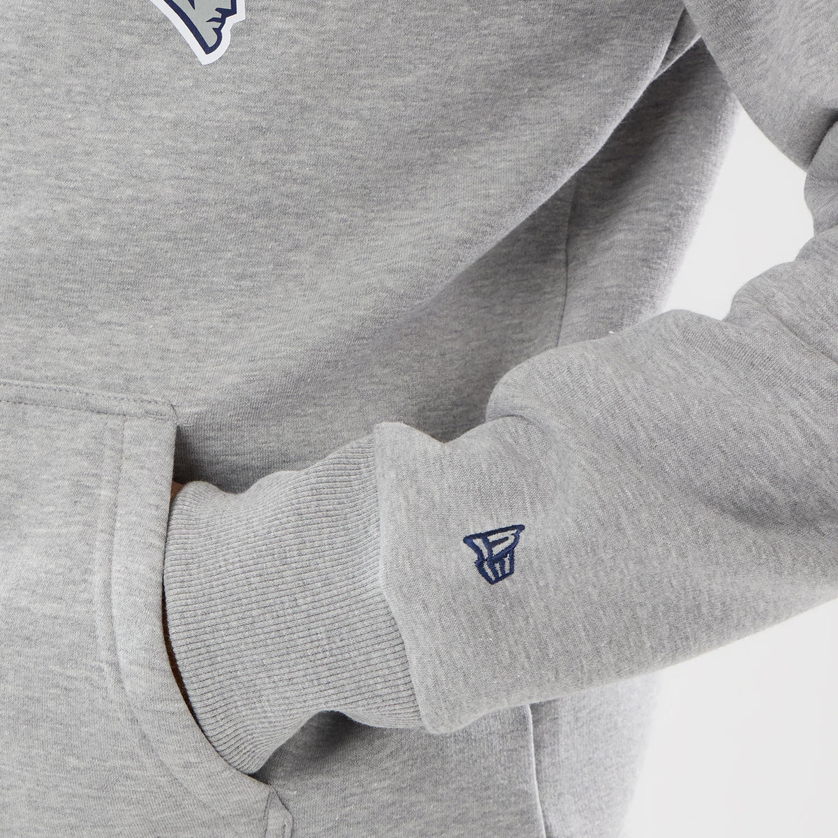 The model is wearing this NFL International Series Games 2026 New England Patriots Pullover Hoodie in grey. 5