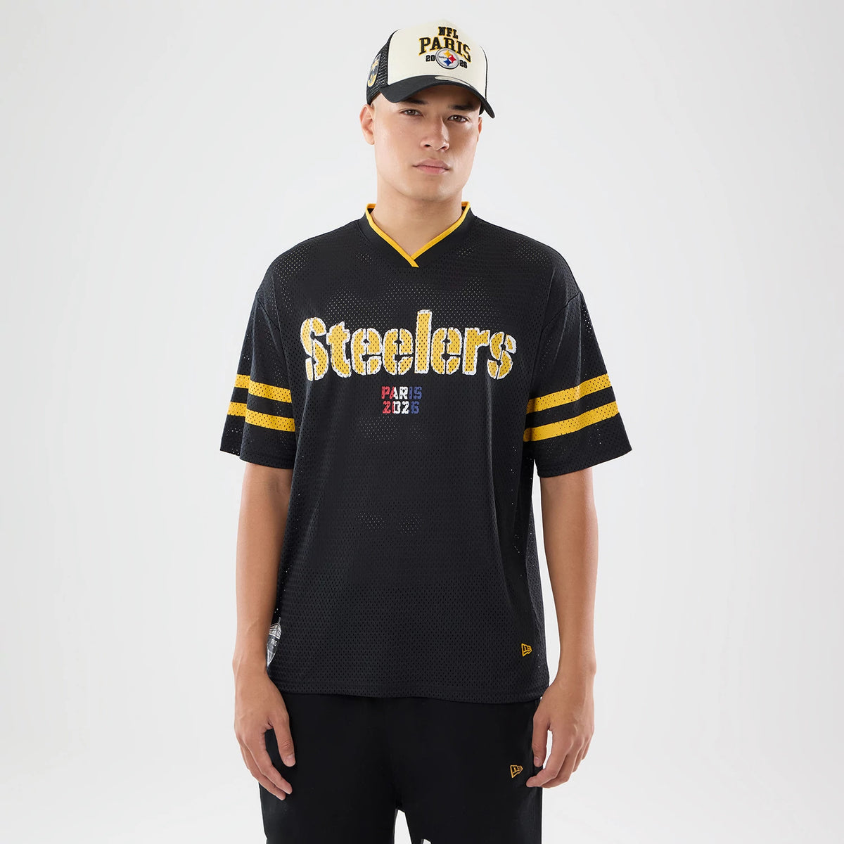 The model is wearing this NFL International Series Games 2026 Pittsburgh Steelers Mesh Jersey in black. 1