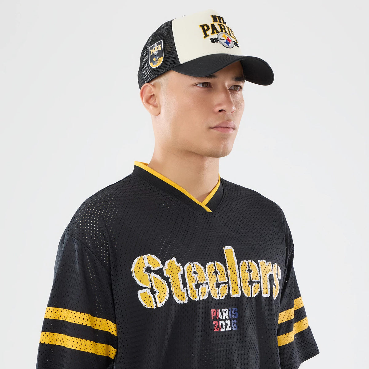 The model is wearing this NFL International Series Games 2026 Pittsburgh Steelers Mesh Jersey in black. 6