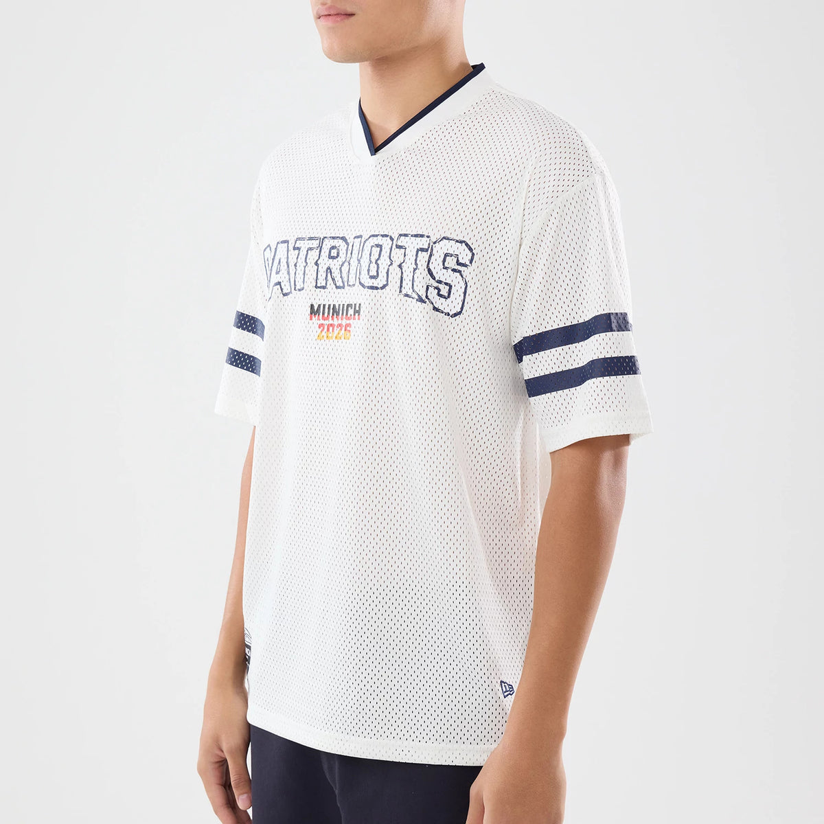 The model is wearing this NFL International Series Games 2026 New England Patriots Mesh Jersey in white. 3