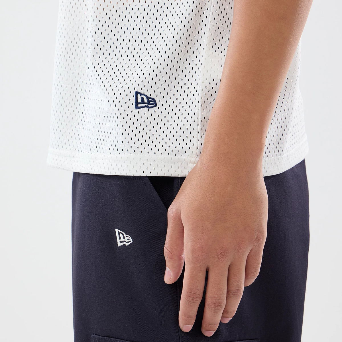 The model is wearing this NFL International Series Games 2026 New England Patriots Mesh Jersey in white. 5