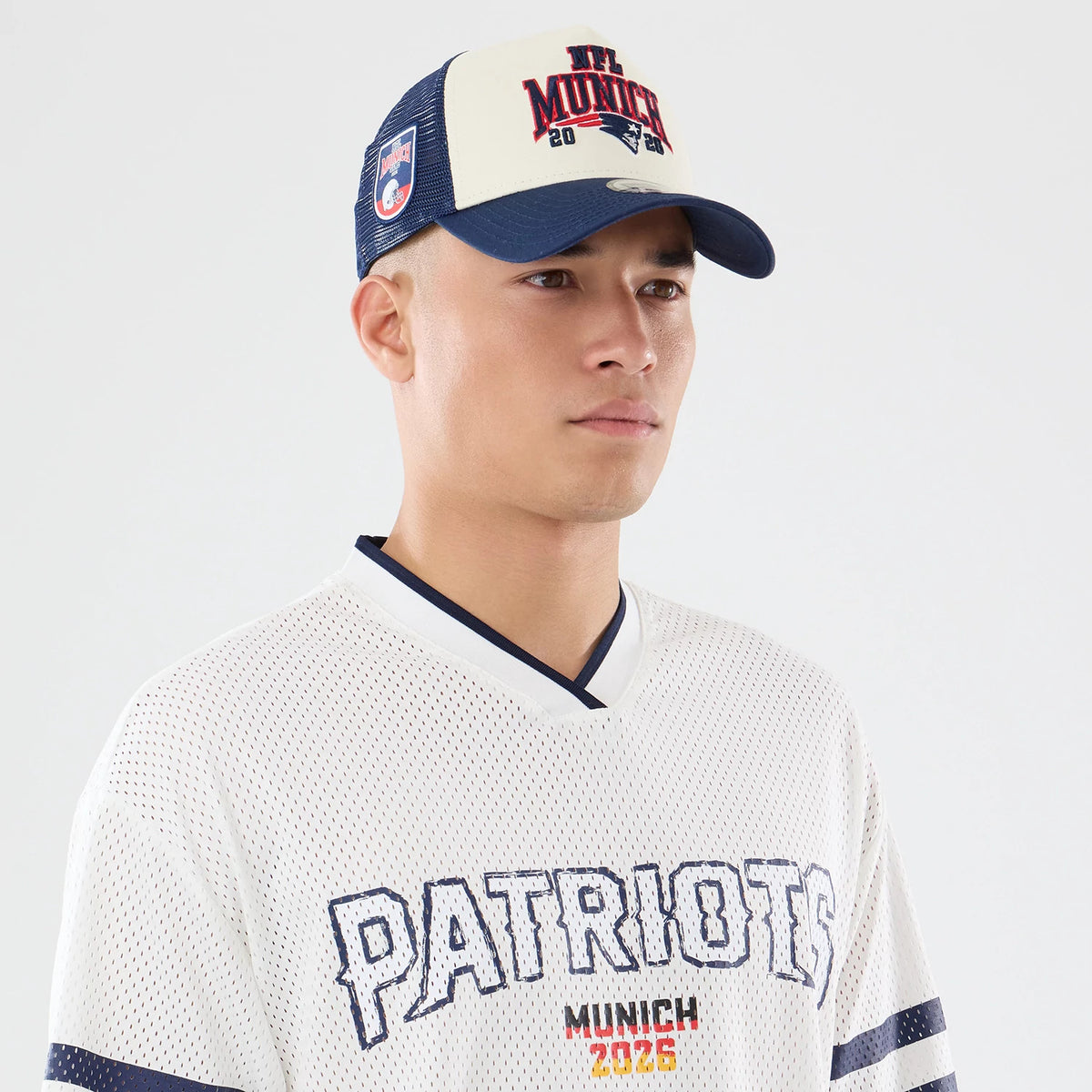 The model is wearing this NFL International Series Games 2026 New England Patriots Mesh Jersey in white. 6