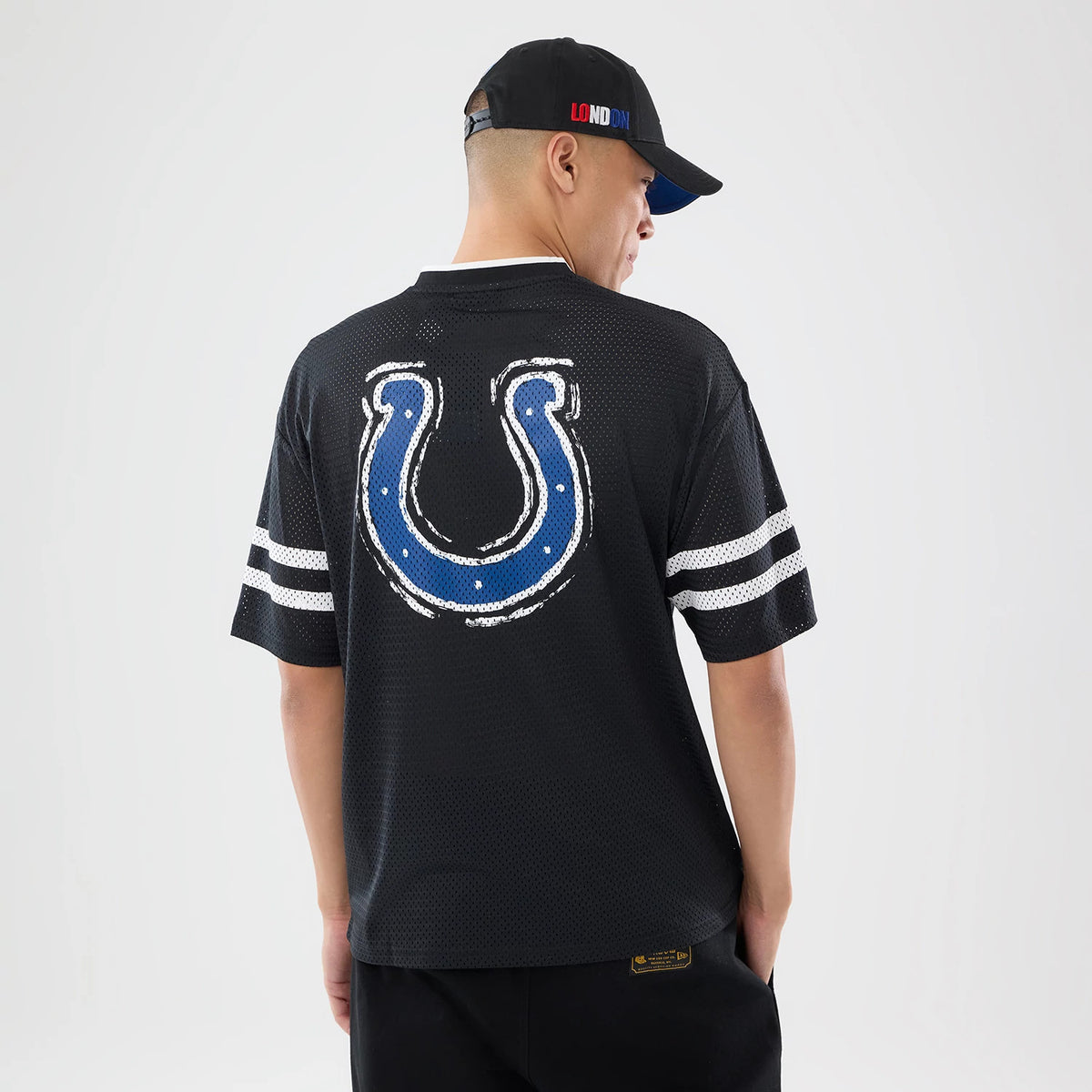 The model is wearing this NFL International Games 2026 Indianapolis Colts Mesh Jersey in black. 2