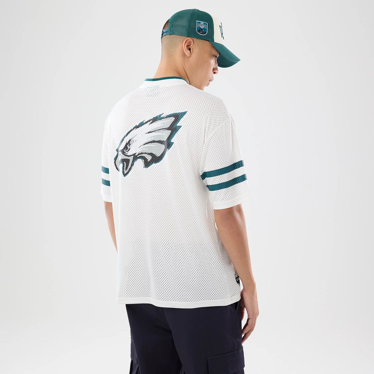 The model is wearing this NFL International Series Games 2026 Philadelphia Eagles Mesh Jersey in white. 2