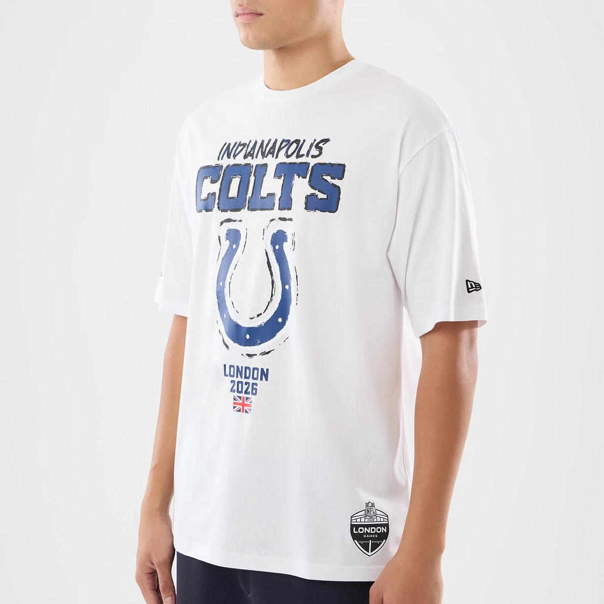 The model is wearing this NFL International Series Games 2026 Indianapolis Colts Oversized T-Shirt in white. 3