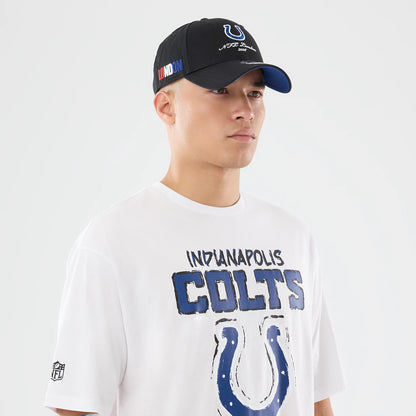 The model is wearing this NFL International Series Games 2026 Indianapolis Colts Oversized T-Shirt in white. 6