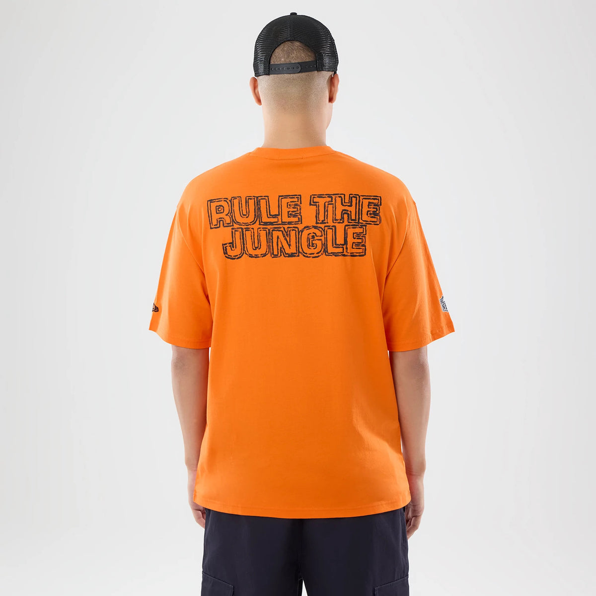 The model is wearing this NFL International Series Games 2026 Cincinnati Bengals Oversized T-Shirt in orange. 2