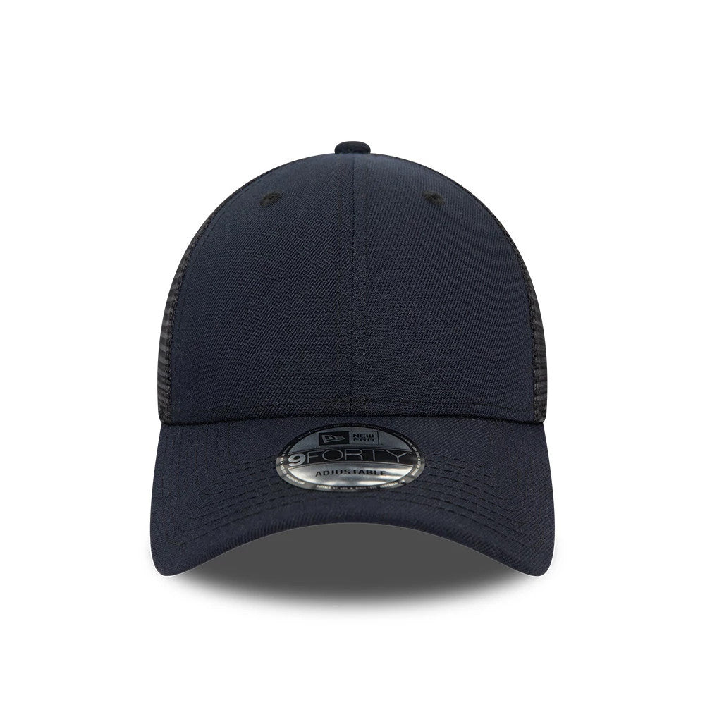 New Era Blank Navy 9FORTY Trucker Cap, front view showing a curved navy visor with a 9FORTY size sticker and mesh side panels, featuring a structured front panel without any logo or embroidery.