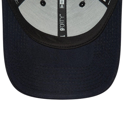 New Era Blank Navy 9FORTY Trucker Cap, inside view showing the black sweatband with white printed 9FORTY branding, black taping running along the seams, and a grey undervisor with matching navy stitching on the visor edge.