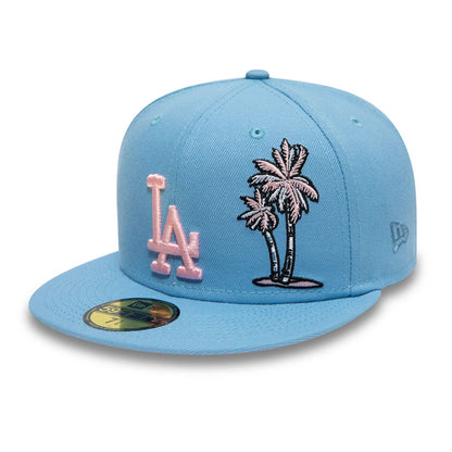 LA Dodgers Palm Taco Blue New Era 59FIFTY Cap, front view showing a raised pink LA logo and palm tree embroidery on the light blue front panels, with a blue flat visor and a gold 59FIFTY size sticker on the top.