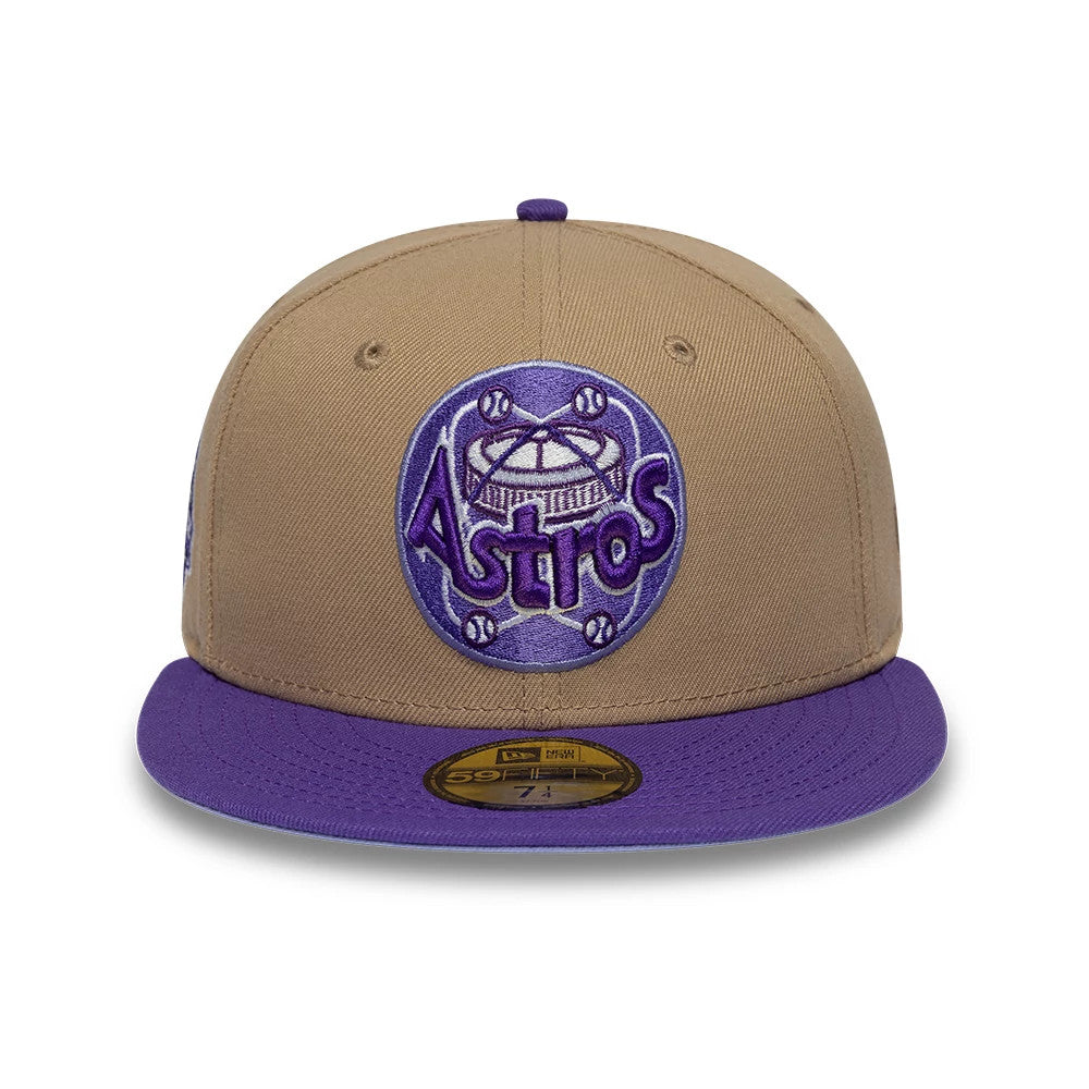 Houston Astros MLB Cooperstown Beige New Era 59FIFTY Fitted Cap, front view showing a purple and white embroidered Astros logo on the beige front panel, complemented by a purple flat visor and a gold 59FIFTY size sticker on the visor.