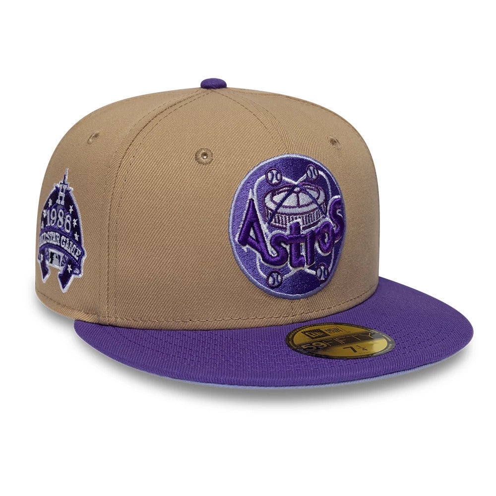 Houston Astros MLB Cooperstown Beige New Era 59FIFTY Fitted Cap, front view showing a purple and white embroidered Astros logo on the front panel, a purple flat visor with a gold 59FIFTY size sticker, and an anniversary patch on the right side.