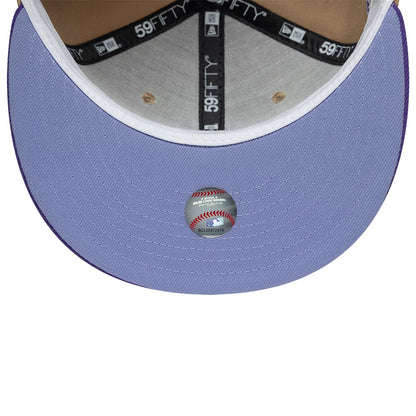 Houston Astros MLB Cooperstown Beige New Era 59FIFTY Fitted Cap, inside view showing the black branded taping and grey sweatband, with a lilac undervisor featuring a baseball-shaped holographic sticker at its centre.