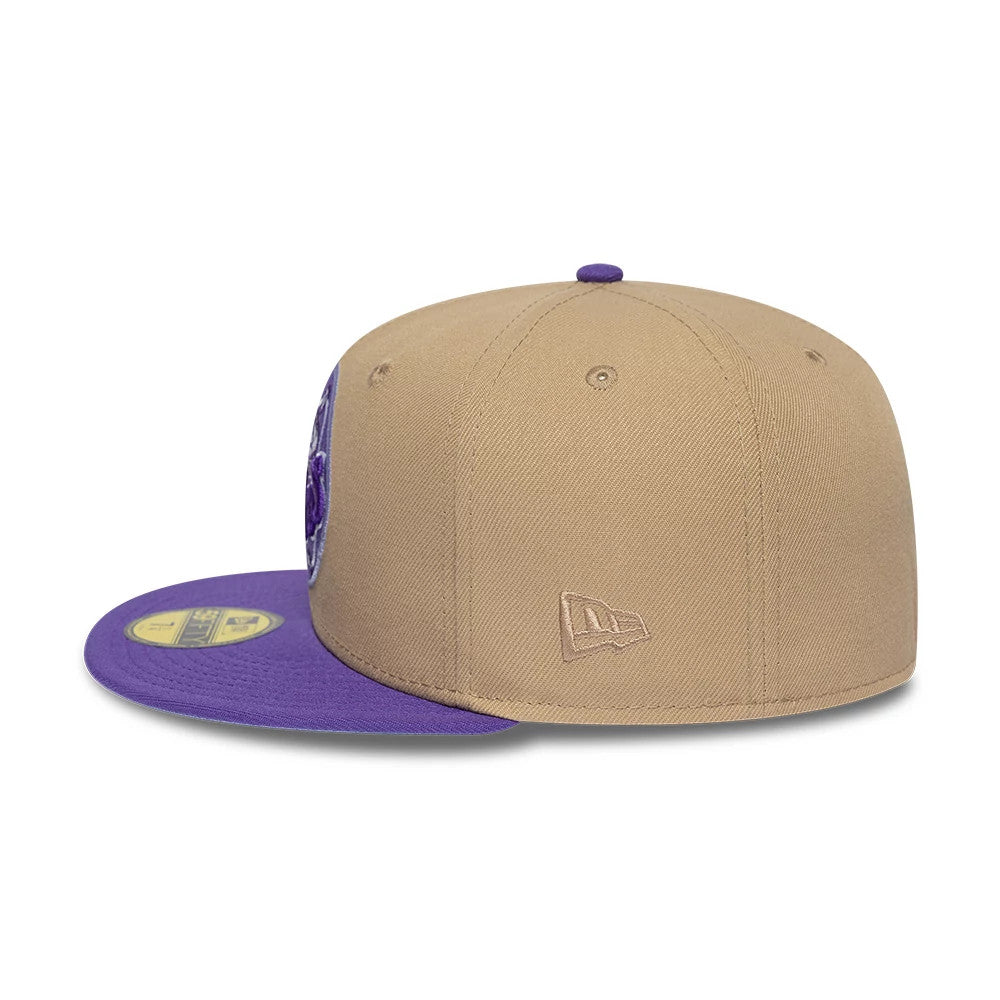 Houston Astros MLB Cooperstown Beige New Era 59FIFTY Fitted Cap, side view showing the beige New Era flag logo embroidered on the left side of the structured beige crown, with a purple flat visor and a gold 59FIFTY size sticker on top.