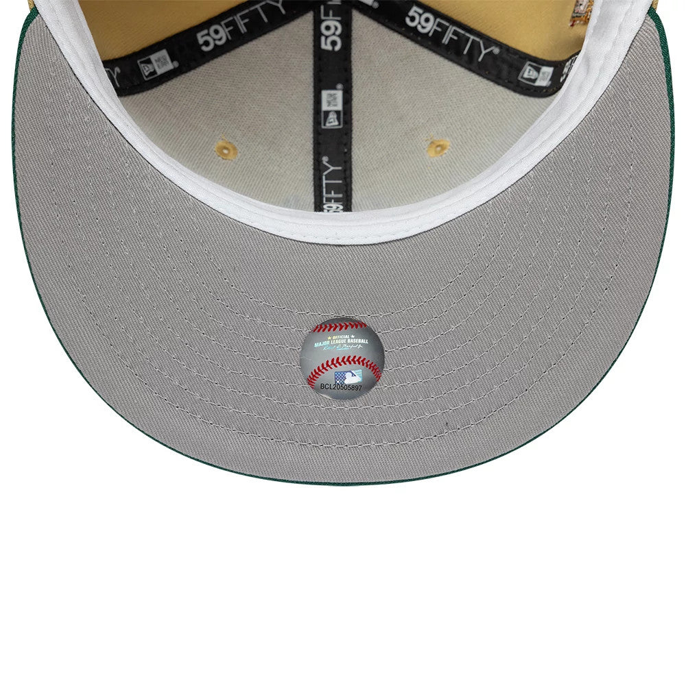 Pictured is this MLB Vegas Seattle Mariners 59FIFTY Fitted cap in gold. 2