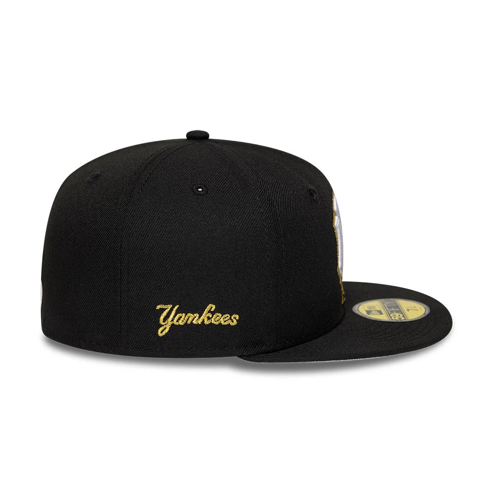 New York Yankees MLB Empire State Black New Era 59FIFTY Fitted Cap, three-quarter view showing the gold Yankees embroidery on the side panel, structured black crown with black eyelets, and a gold 59FIFTY size sticker on a flat black visor.