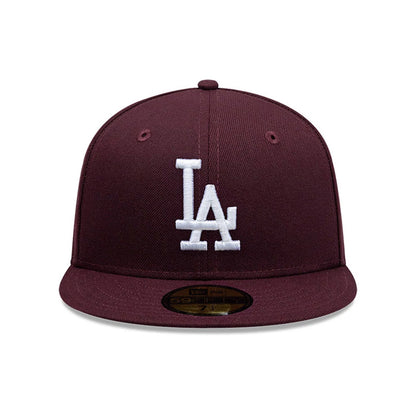LA Dodgers MLB Dark Purple New Era 59FIFTY Fitted Cap, front view showing the raised white embroidered LA logo on the structured dark purple crown, with a matching flat visor and a gold 59FIFTY size sticker on the visor.