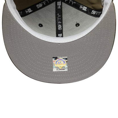 Lake Elsinore Storm MiLB Pinwheel Green New Era 59FIFTY Fitted Cap, inside view showcasing black 59FIFTY taping, a grey undervisor, and a holographic authenticity sticker in the centre displaying the MiLB logo and series number.