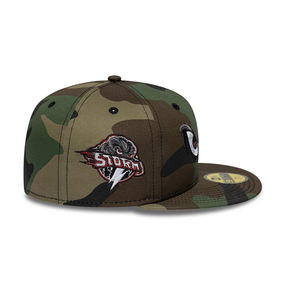 Lake Elsinore Storm MiLB Pinwheel Green New Era 59FIFTY Fitted Cap, side view showing a multi-panel green camo pattern, red and black embroidered Storm logo on front panels, and a gold 59FIFTY size sticker on the flat camo visor.