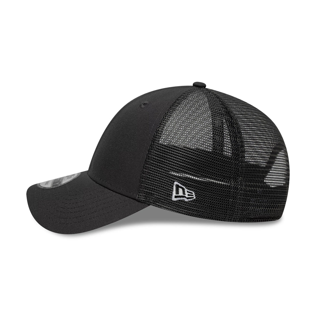 New Era Grey 9FORTY Trucker Adjustable Cap, side view showing the white embroidered New Era flag logo on the mesh back panel, with a curved black visor and black 9FORTY size sticker on the bill.