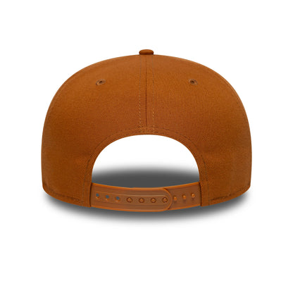 New Era Brown 9FIFTY Snapback Adjustable Cap, rear view showing the brown plastic snapback closure with multiple adjustment notches, partially top button, and matching brown crown fabric with panel seams and embroidered eyelets.