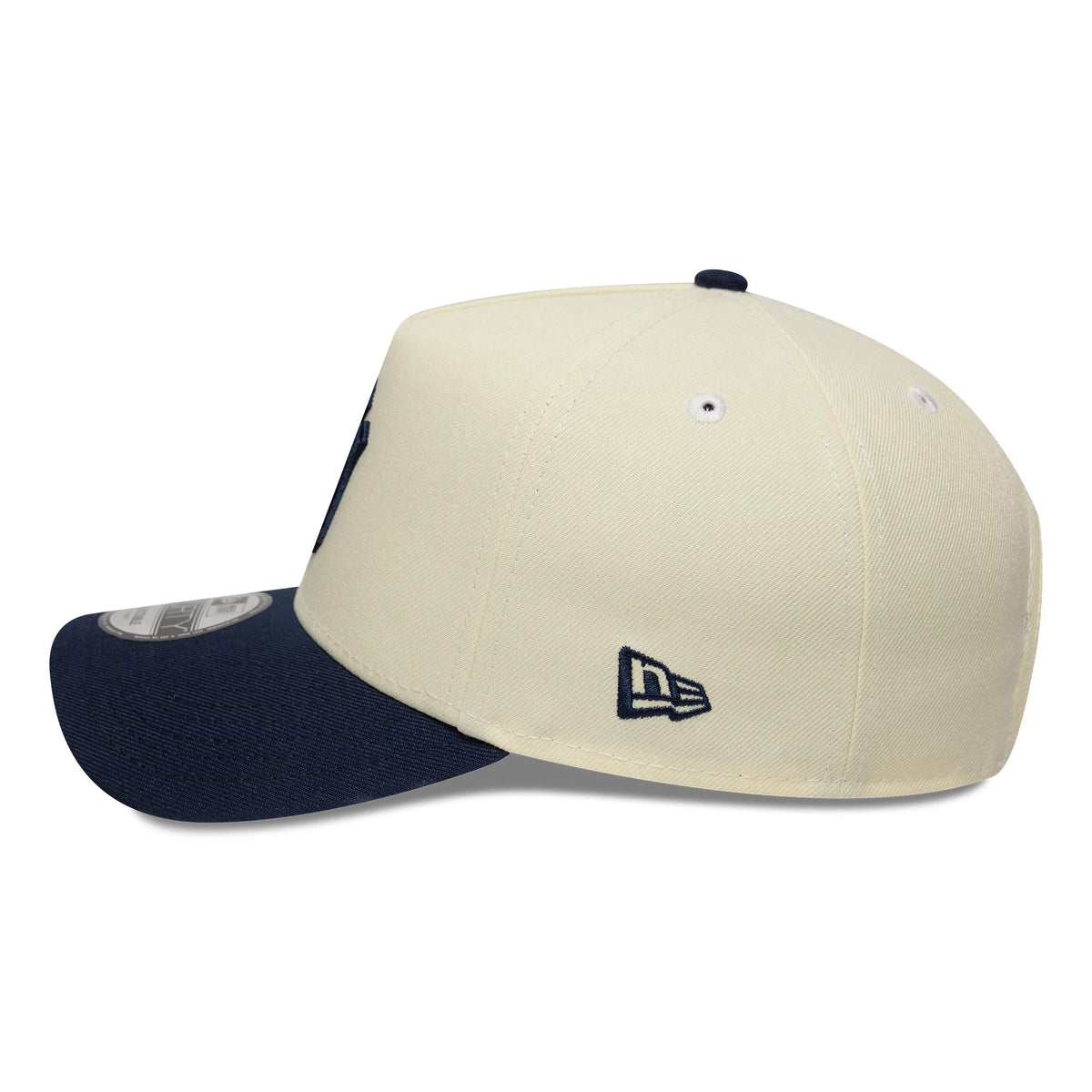 New York Yankees MLB Chrome Blue Contrast Cream New Era 9FORTY A-Frame Adjustable Cap, side view showing the navy embroidered New Era flag logo on the cream crown, a structured profile.