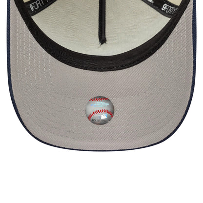 Chicago White Sox MLB Chrome Blue Contrast Cream New Era 9FORTY A-Frame Adjustable Cap, inside view showing the grey undervisor with a baseball graphic sticker, black interior sweatband, and cream panel taping.