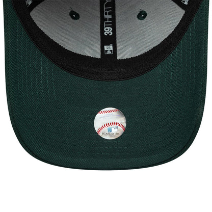 New York Yankees MLB Dark Green New Era 39THIRTY Stretch Fit Cap, inside view showing the grey undervisor with a round MLB authenticity sticker, dark green eyelets, and black interior taping with a 39THIRTY logo and New Era branding.