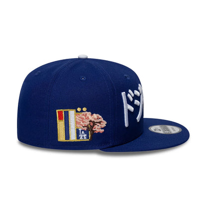 Pictured is this MLB Kanji LA Dodgers 9FIFTY Snapback Adjustable cap in dark blue. 5